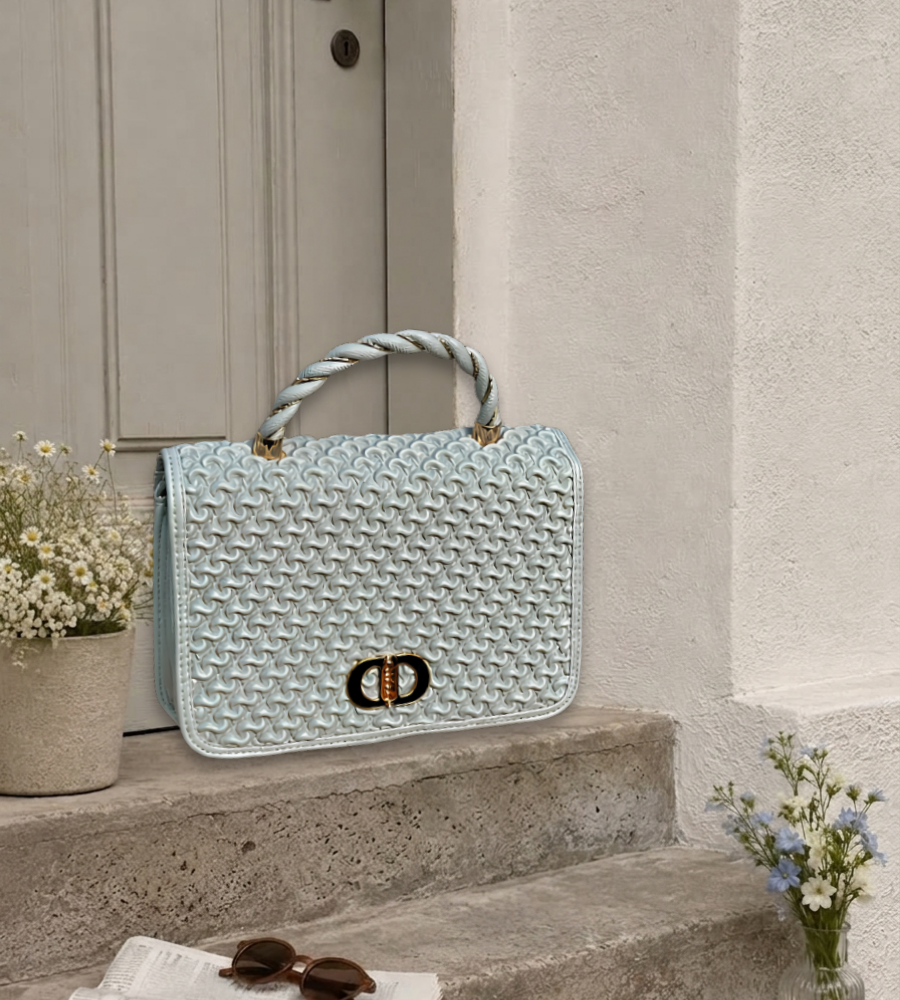 Ice blue woven-textured top-handle bag with a braided handle and gold buckle