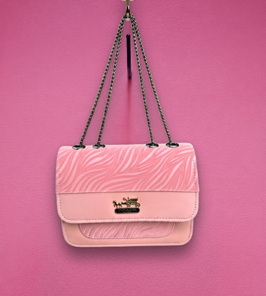 Pink textured flap shoulder bag with a chain strap and gold clasp