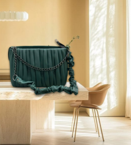 Deep teal pleated shoulder bag with a chain strap
